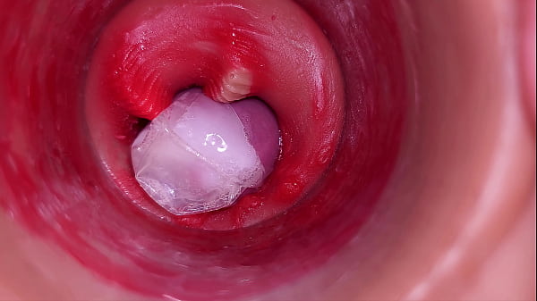 The camera inside the deep pussy records a huge ejaculation with a stuck condom